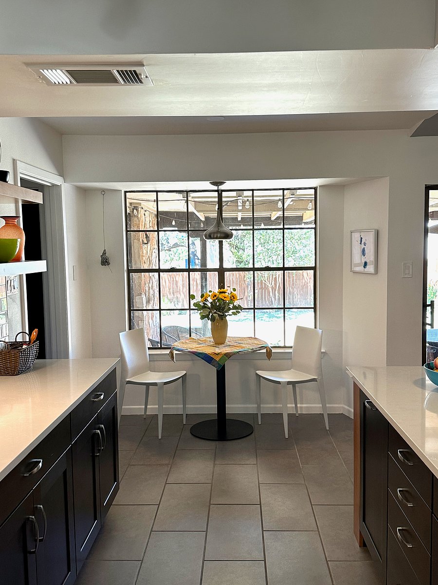 Bistro table includes four chairs and looks out to rear terrace and back yard