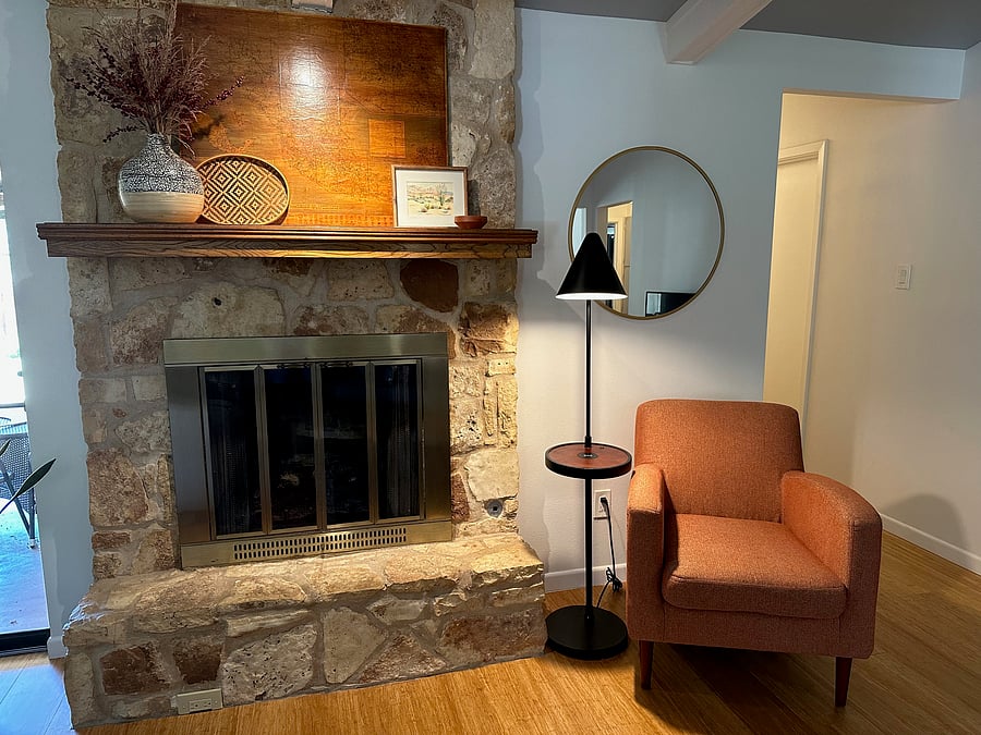 Cozy reading chair in opposite corner of livingroom