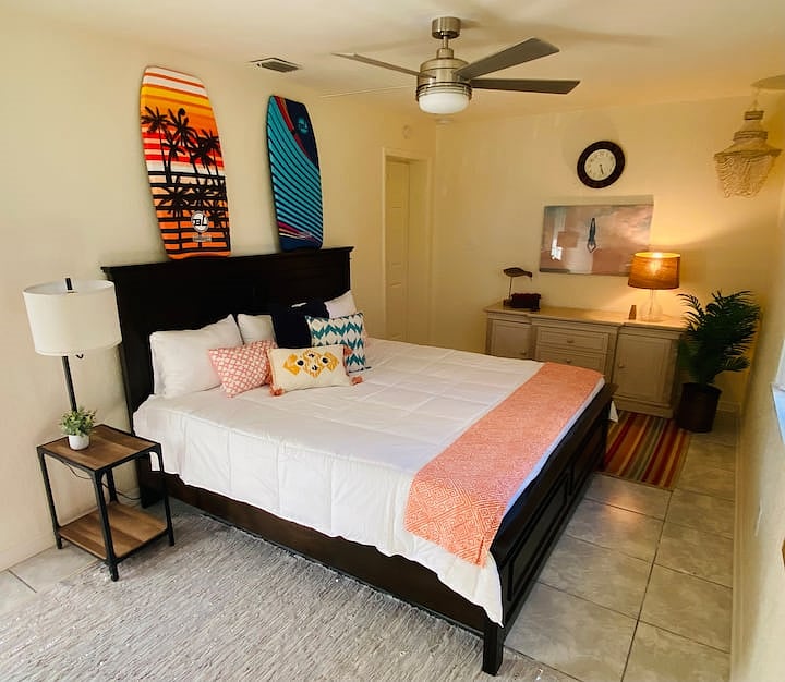 Themed surf room with large lounging area and a king size luxury mattress.