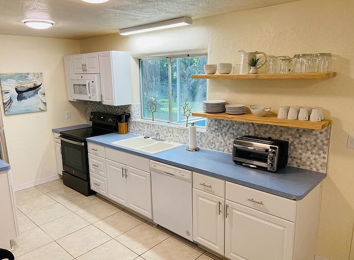 Large galley eat in kitchen, fully equipped with cooking pots, pans, utensils, plates, glasses, cups, etc. Even coffee maker and toaster, new microwave. Everything you need!