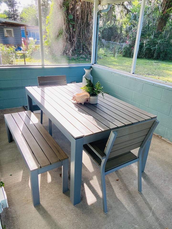 Back patio dining area where you might see wild turkeys crossing in the morning.