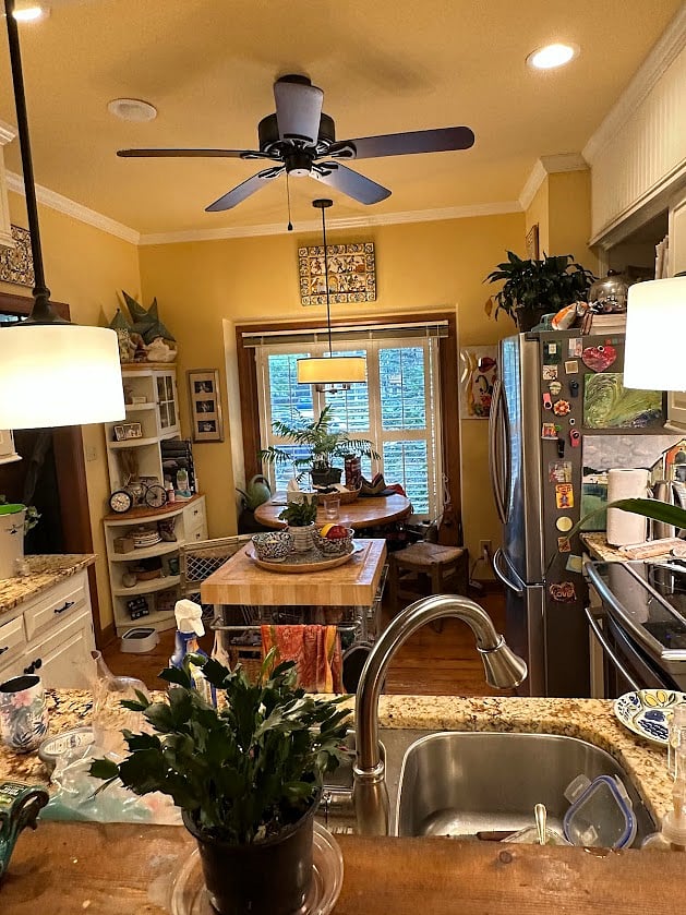 Looking into kitchen through pass from dining area.
