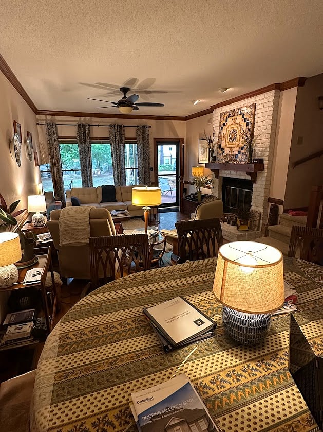 View from kitchen of dining/living area, and through window of back pond.