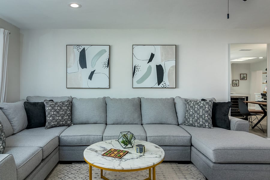 Living Room - Large sectional sofa with queen sofa sleeper. 65" Smart TV