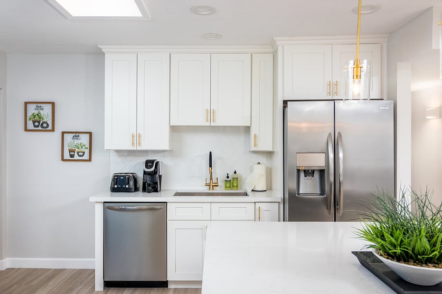 Kitchen - Full-sized Refrigerator, Dish Washer, Microwave, Gas Stove, Toaster, Coffee Maker, Keurig, Cooking Essentials, Silverware, Plates, Bowls, Cups, Bar Kit, and Wine Refrigerator