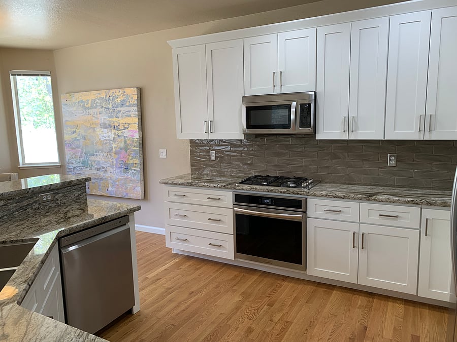 The kitchen was recently remodeled by an interior designer and includes brand new stainless steel appliances.