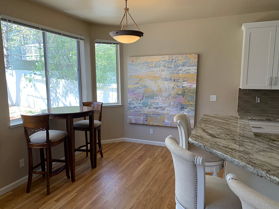 There is additional seating for two on a high top table is located right by the bar.