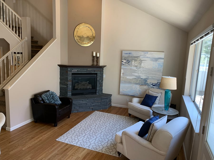 Formal living area includes gas fireplace.