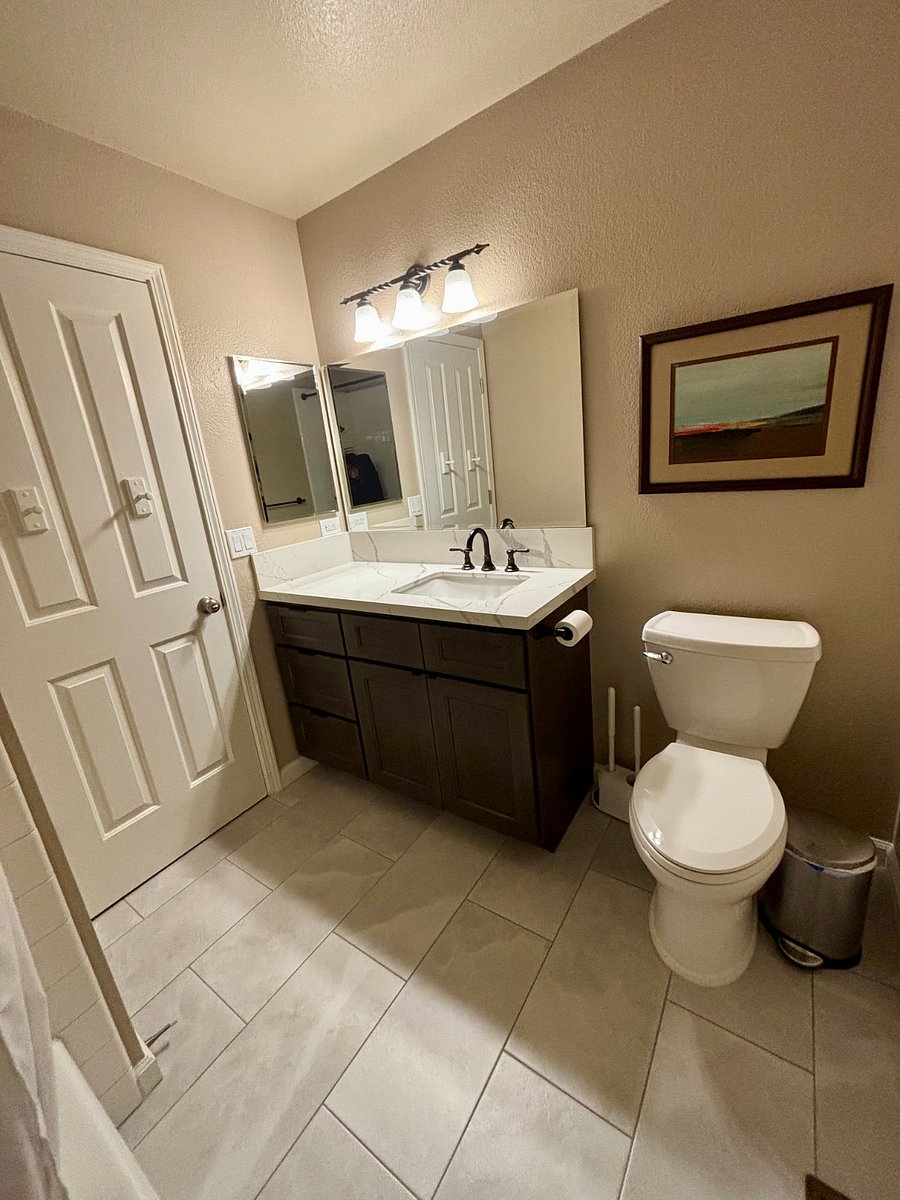 Recently renovated bathroom with new countertops, cabinets and floor. This bath will be shared.