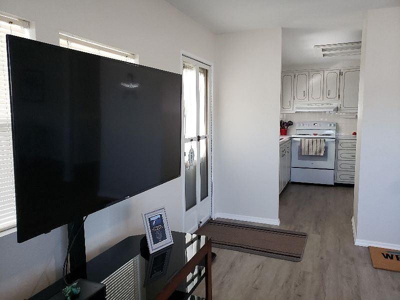 50" Roku Smart TV can be viewed from multiple areas due to the open floor plan.
