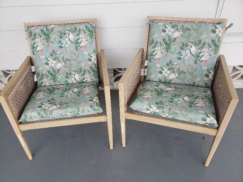 2 sturdy outdoor chairs tucked under carport for shade. Take advantage of the wonderful breezeway.