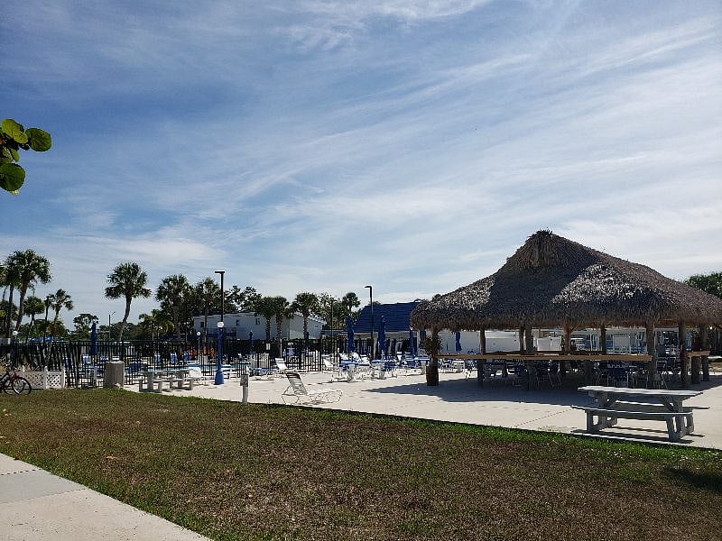 Tiki hut is close to the larger pool. Great to go back and forth as you wish, to get in ample sun and shade.