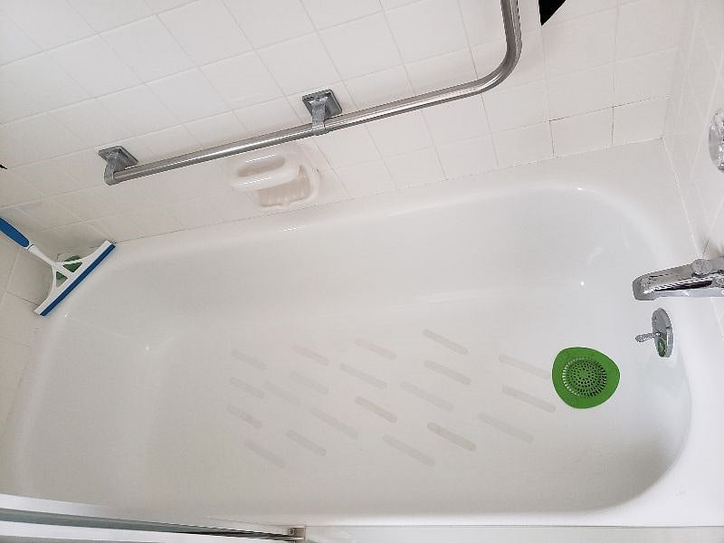 Main Bathroom tub has non-slip strips and ADA bars.