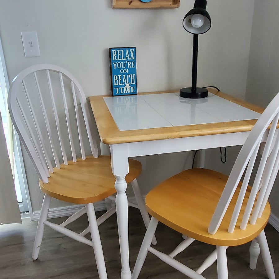 Table for 2 to 4 in nook area perfect for enjoying a cup of coffee, a relaxing breakfast, puzzling, laptop time, playing games, reading or visiting.