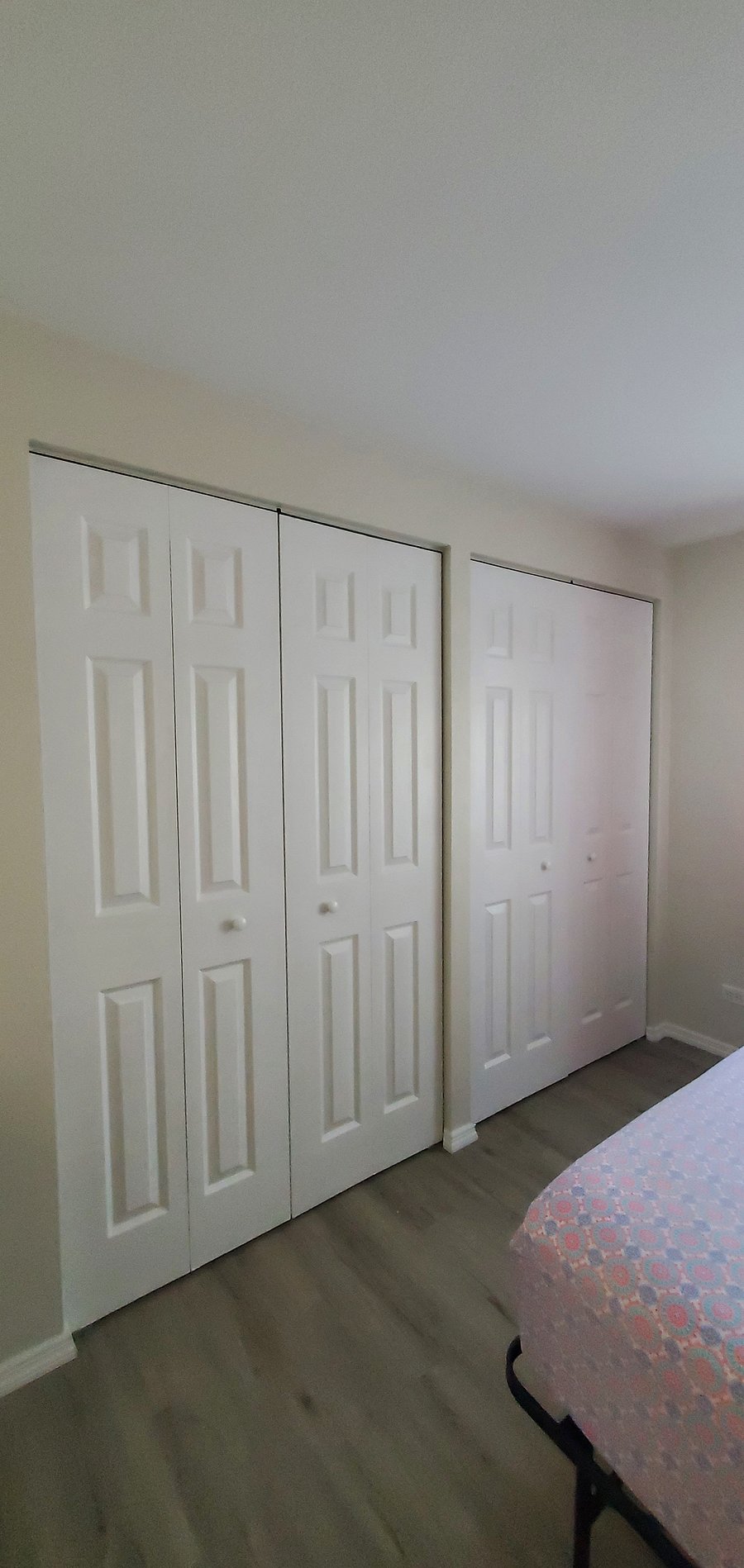 2 large double door closets in Guest Bedroom with top shelf for additional storage space.