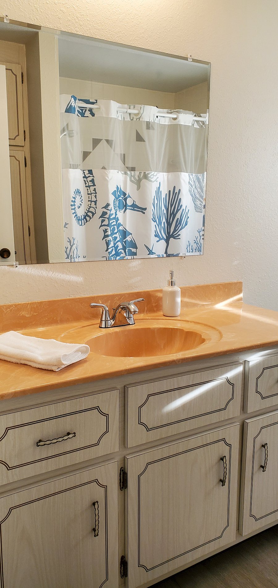 Ventilating seahorse shower curtain with easy, washable, snap-in liner.