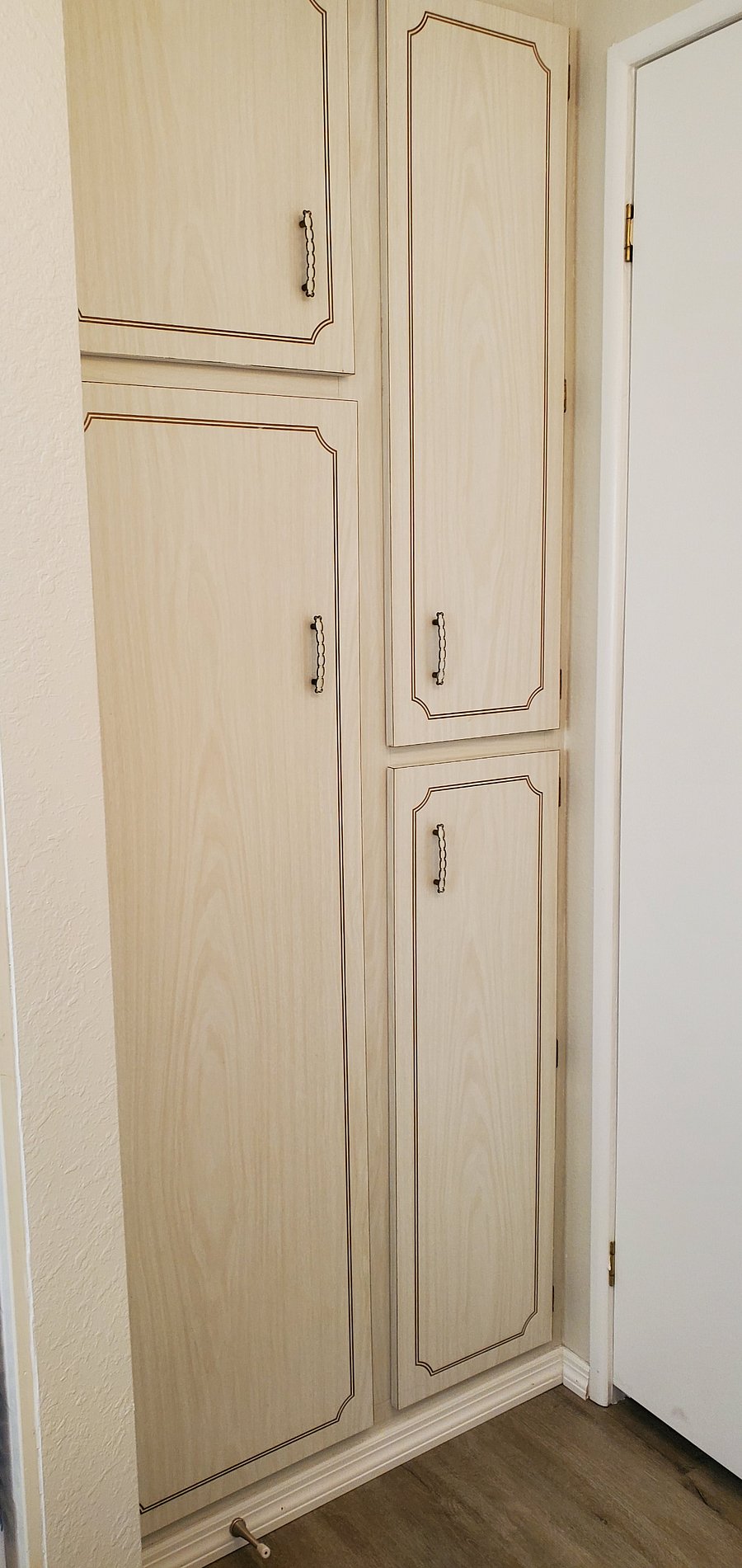 Full size linen closet on right. Full size utility closet on left stores vacuum and mop equipment & supplies.