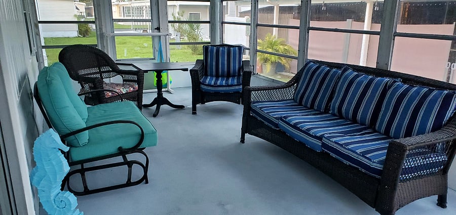 10x22 FL room allows ample seating: 1 full size couch, 1 loveseat glider, 1 chair rocker, 1 chair and a small table for meals