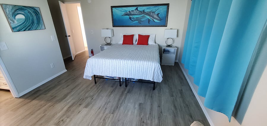 Spacious primary bedroom with Queen bed, ensuite and multiple closets