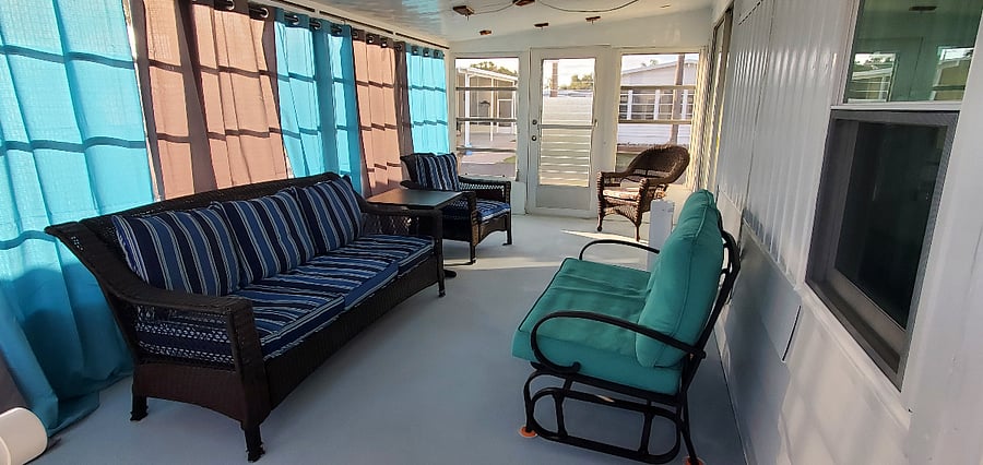 Curtains filter light & keep heat out. Anti-slip floor does not get hot - bare feet welcome. Blue rope lights make evening enjoyment a must. 2 steps to enter FL room from outside.