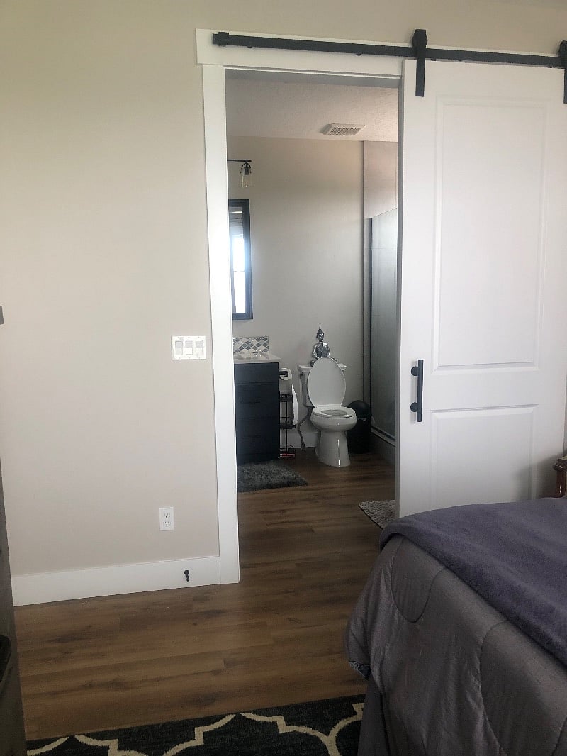 Barn door leading into your master suite bathroom, laundry, and walk-in closet,