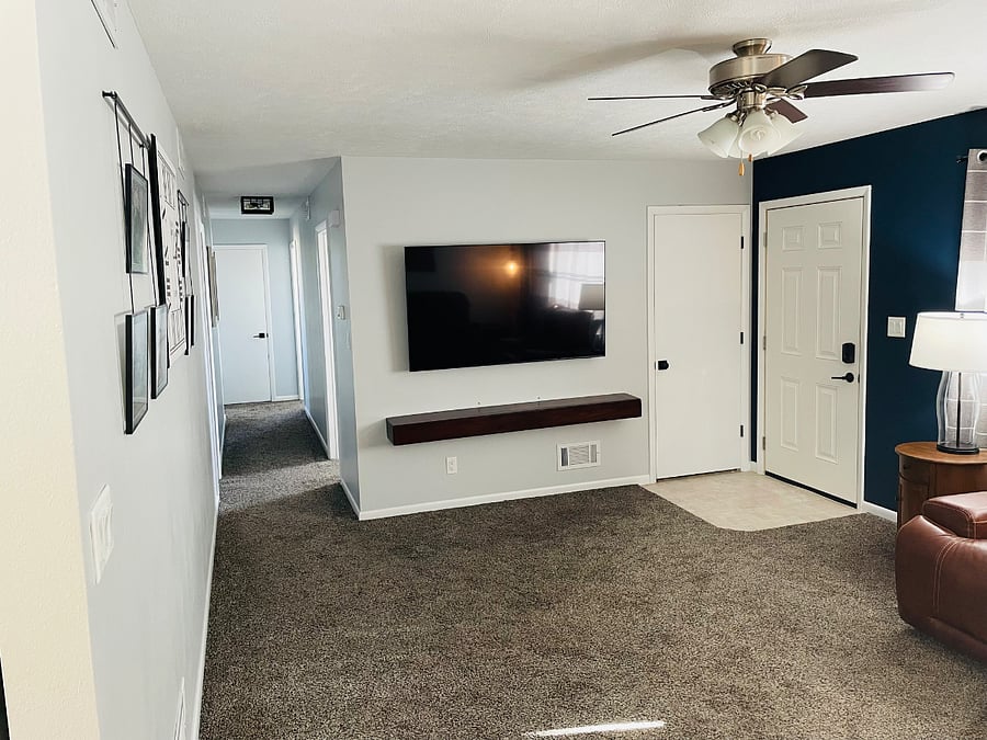 Living Room w/ Hallway to Guest Bathroom, Office, and Bedrooms