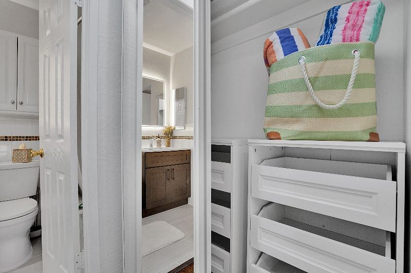 Plenty of drawer storage in closet, including pool bag and towels!