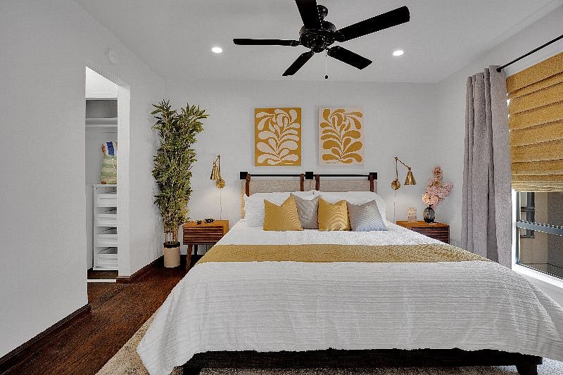 Designer touches with end table lights, and drawers for storage