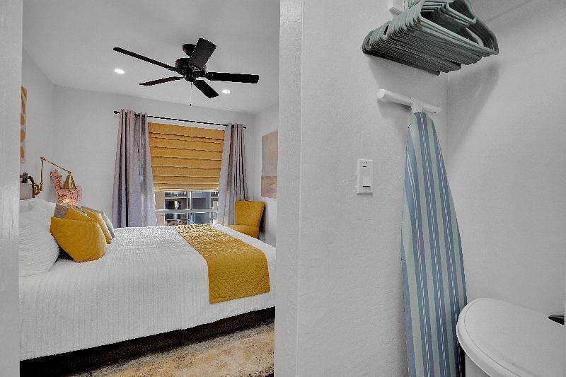 Ironing board and rolling hamper with handle for ease to laundry.