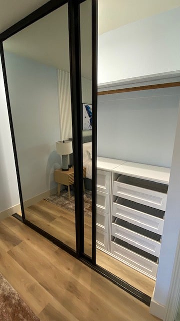 Closets have built in drawers and hangars.