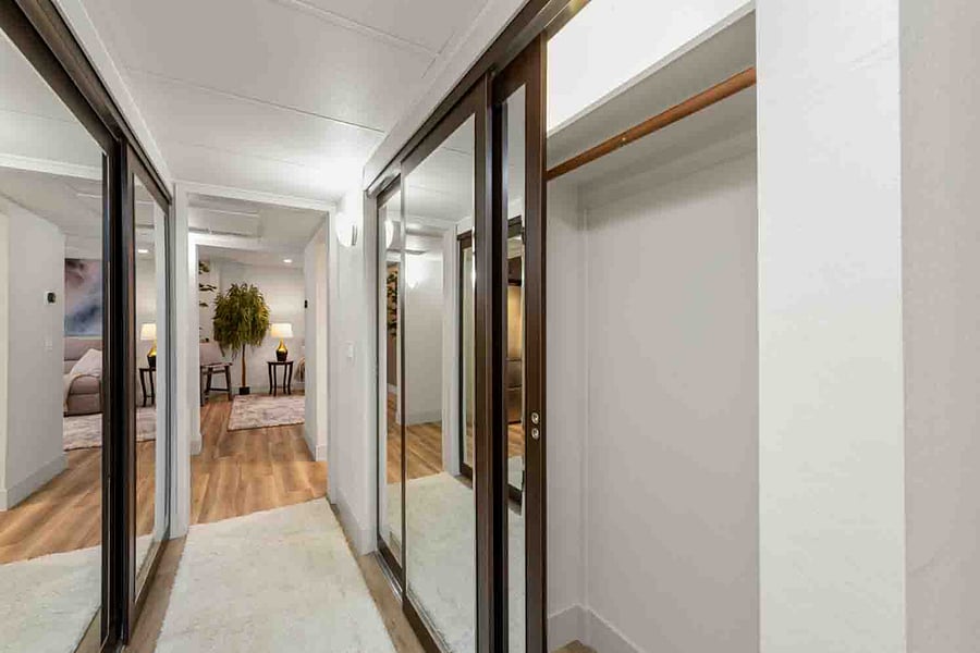 Enjoy the beautiful, mirrored closet doors with ample space for your things!