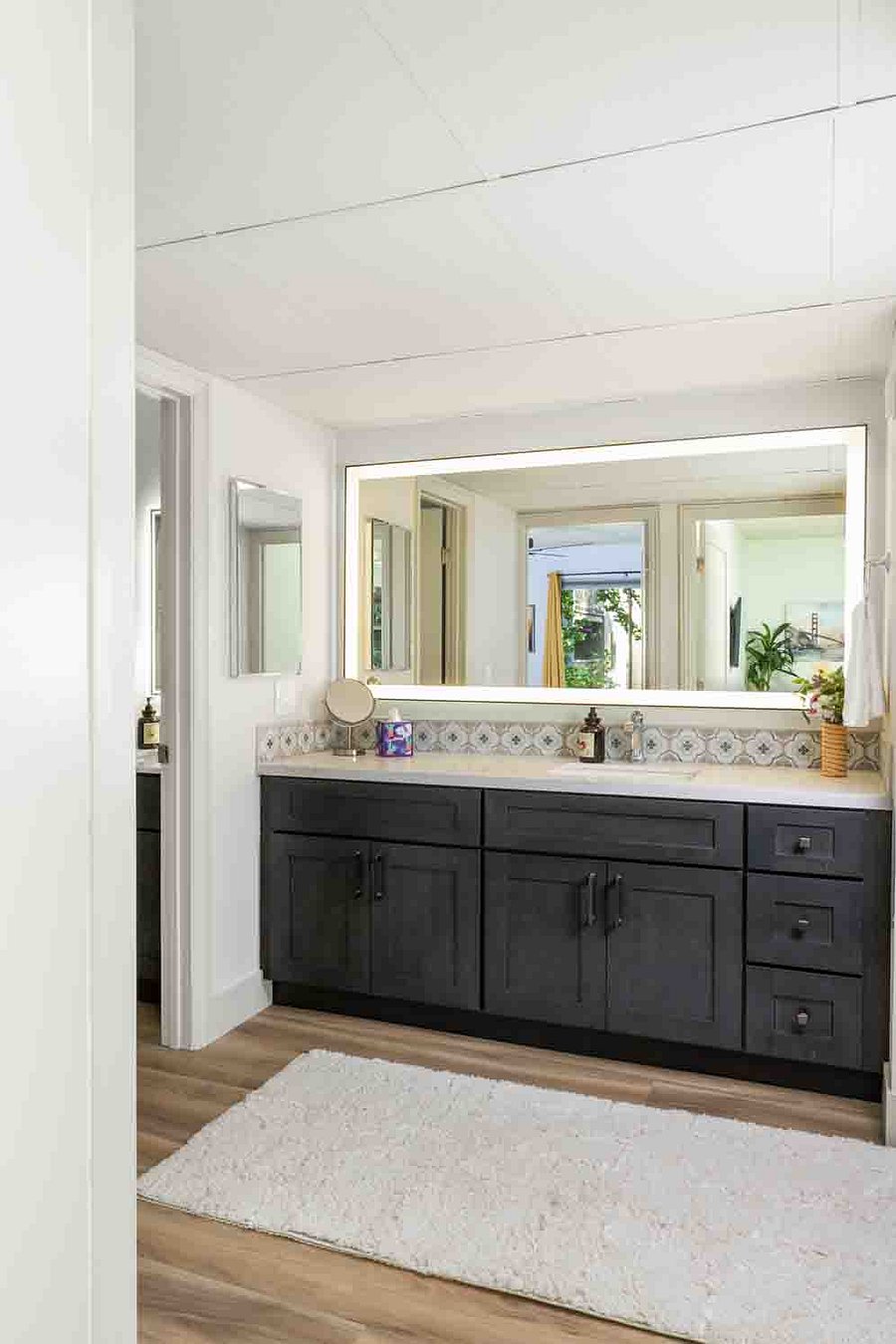 Enjoy the plentiful cabinet space and counter on this large vanity with mirror that can change lighting to your liking!