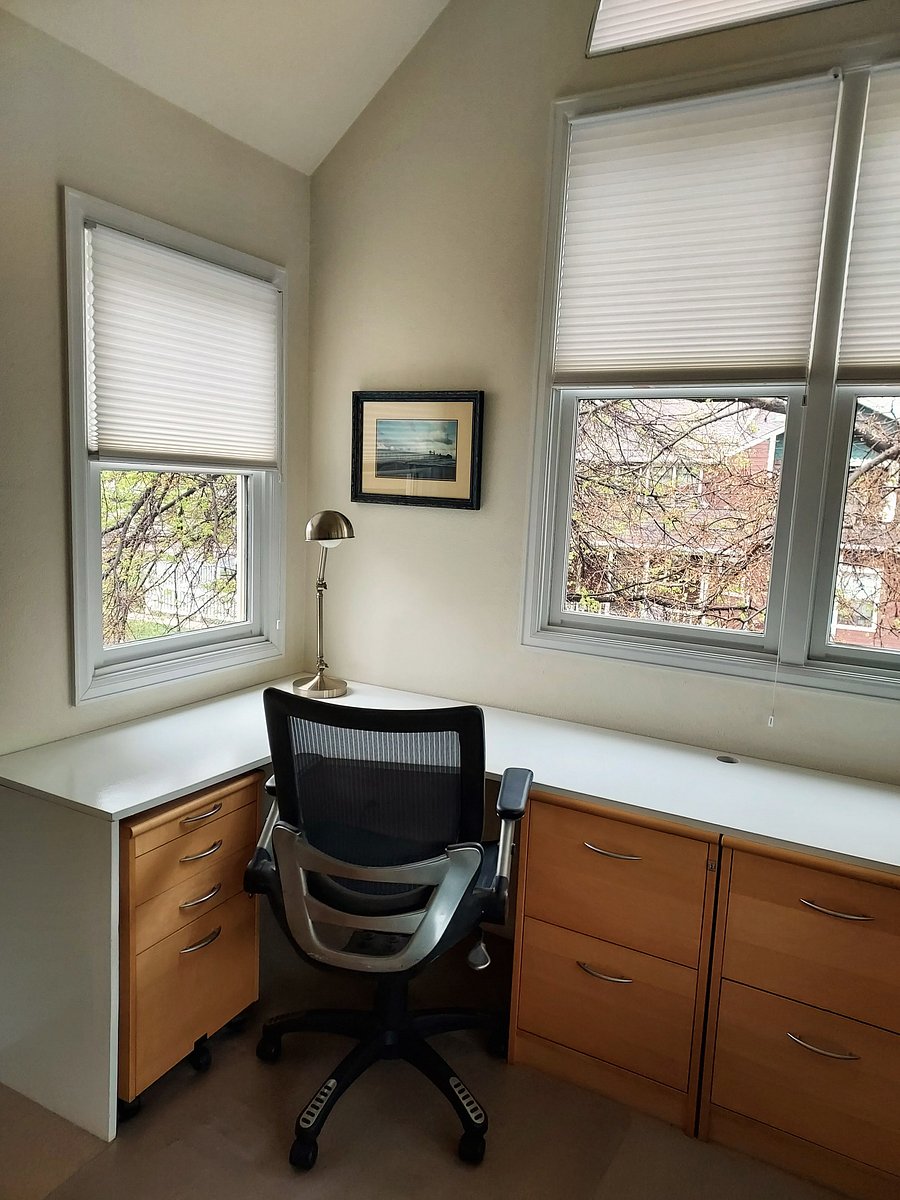 Desk on the left (file cabinets for your use)