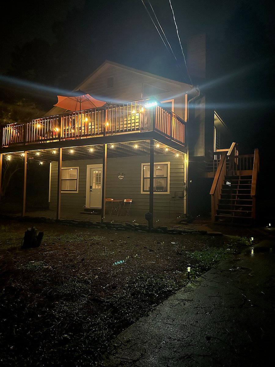 View of the house/patio at night. Plenty of lights that can be turned off/on as you please! 