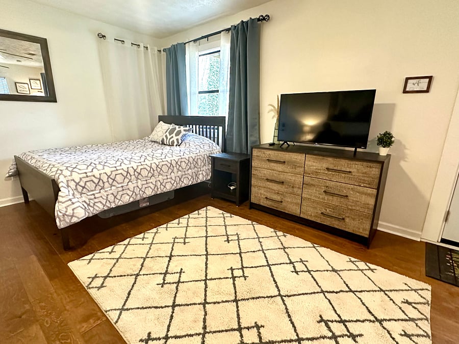 This is the bedroom - a queen sized comfy bed and blackout curtains to make sure you get a great night sleep! 