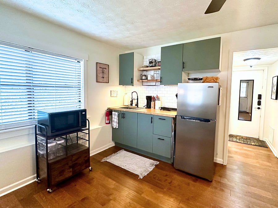 This is your fully stocked kitchen - pots & pans, plates/bowls, utensils, cutting board, cooking utensils, oil & all the basic spices. Appliances include: fridge, 2 burner hotplate, air fryer/micro combo, Keurig (with k cups!). Just like home! 