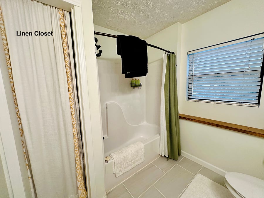 The linen closet has extra towels and blankets, extra sheets, cleaning supplies, laundry basket, etc. 