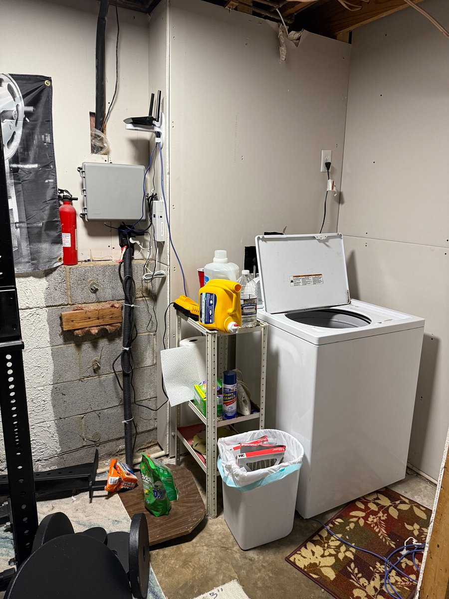 Utility room with washer, dryer, and squat rack