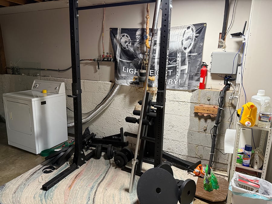 Utility room with washer, dryer, and squat rack