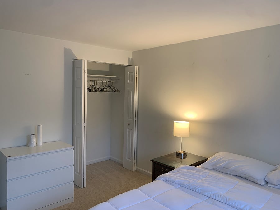 Bedroom with Queen Bed, dresser, closet, and desk with chair for $1,050 and available 08/01/2026