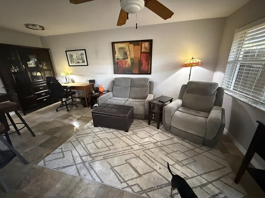 Open living area with desk and hutch