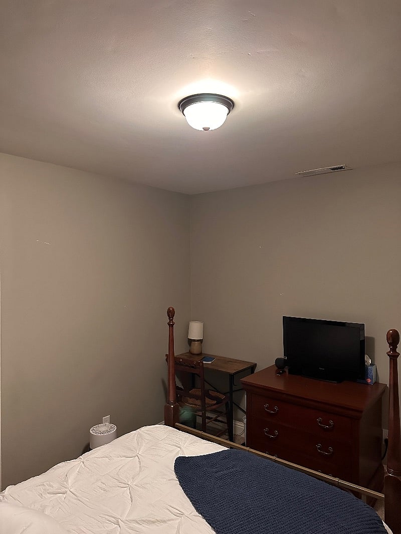 desk with lamp, dresser, tv, appletv to stream your shows and a HomePod.