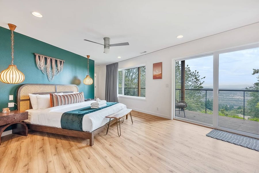 Primary suite with sliding doors opening to private deck, views and enjoys a large spacious bath area with soaking tub, walk in shower and double sinks. Large walk in closet.