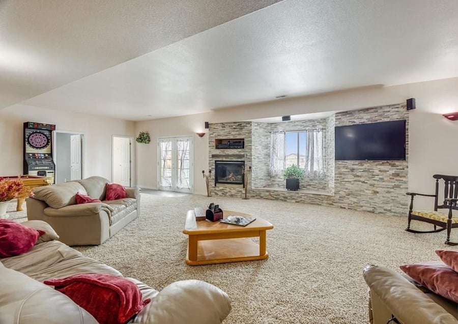Spacious living area with Private french Door entrance. Fireplace, 55" TV, Pool Table, Electronic Dart Board.