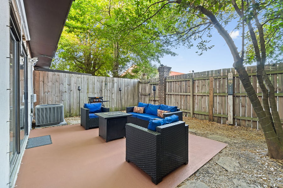 Fenced in Backyard Patio with propane firepit and pull down movie screen
