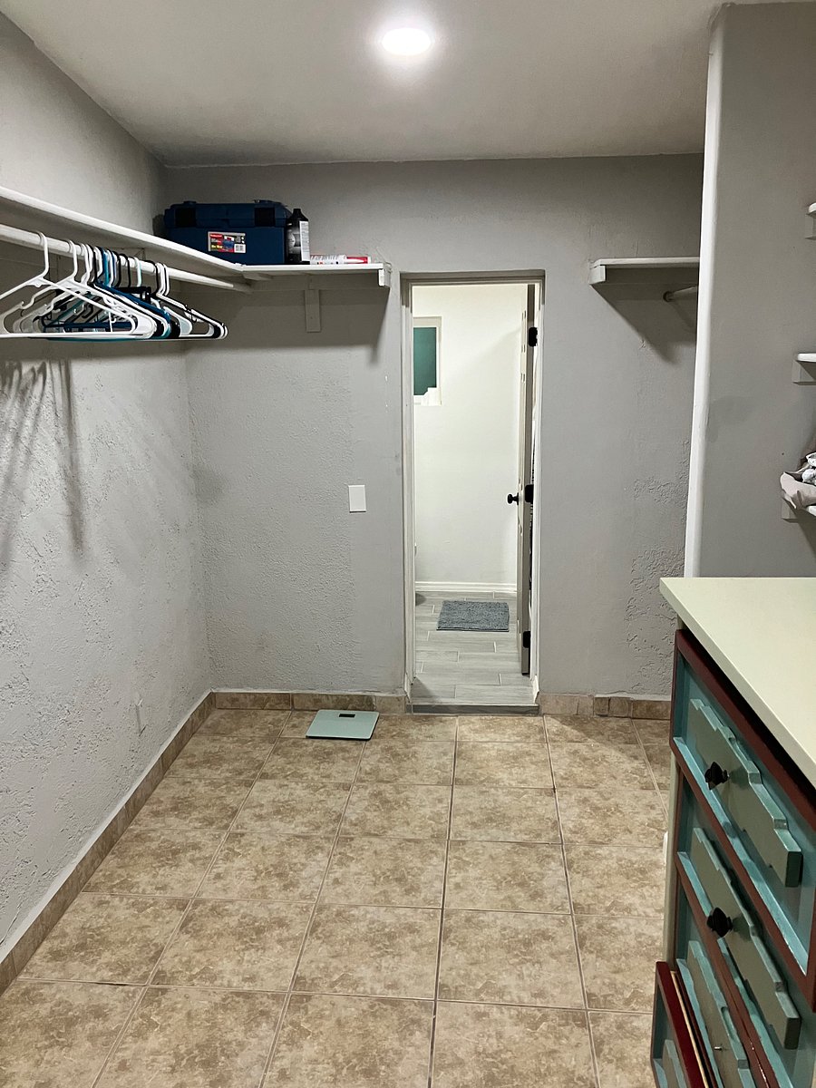 Main bedroom closet with bathroom through door