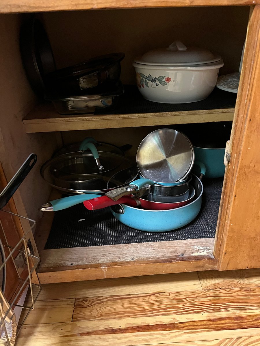 Lots of cookware
Silverware in the drawer above.  