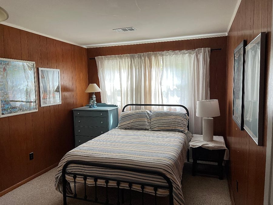 Bedroom allows for plenty of light and alsow has blackout shades.
