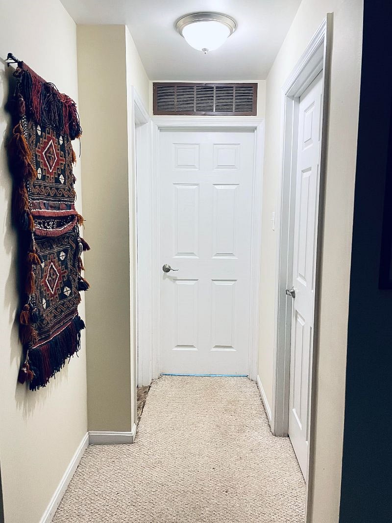 From the living area, straight ahead is the kitchen, Washer /Dryer and ground floor private entrance. The Bathroom is to the left and the bedroom is to the right.