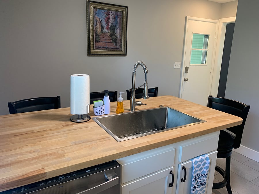 Deep sink and dishwasher make for easy meal cleanup. Access to the back carport off the kitchen as well.